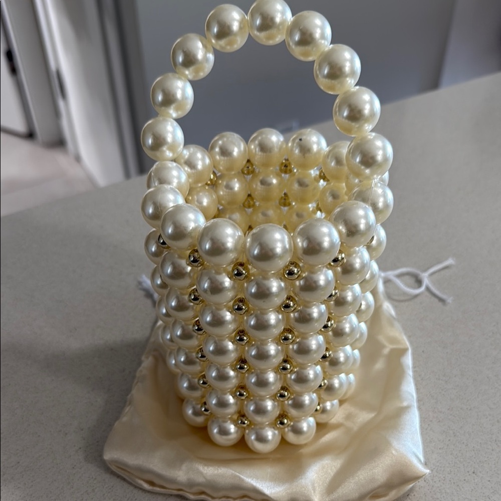Elegant Pearl Beaded Bucket Handbag with gold accents